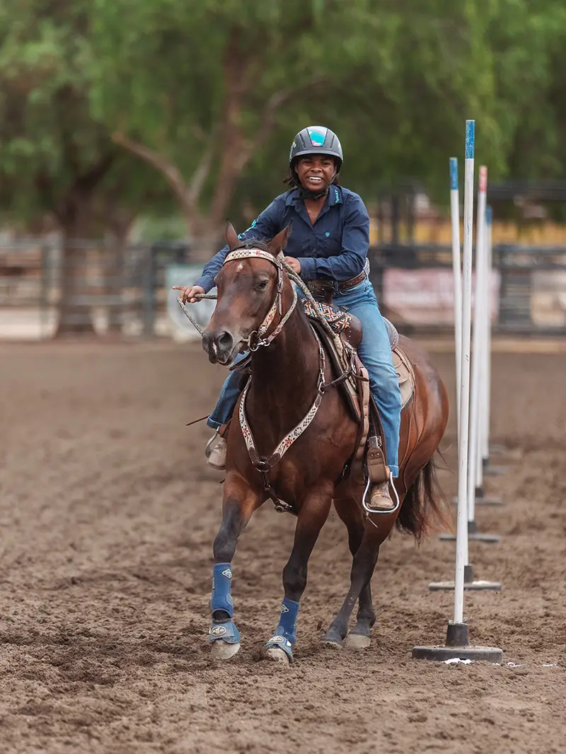 Rider running the poles pattern