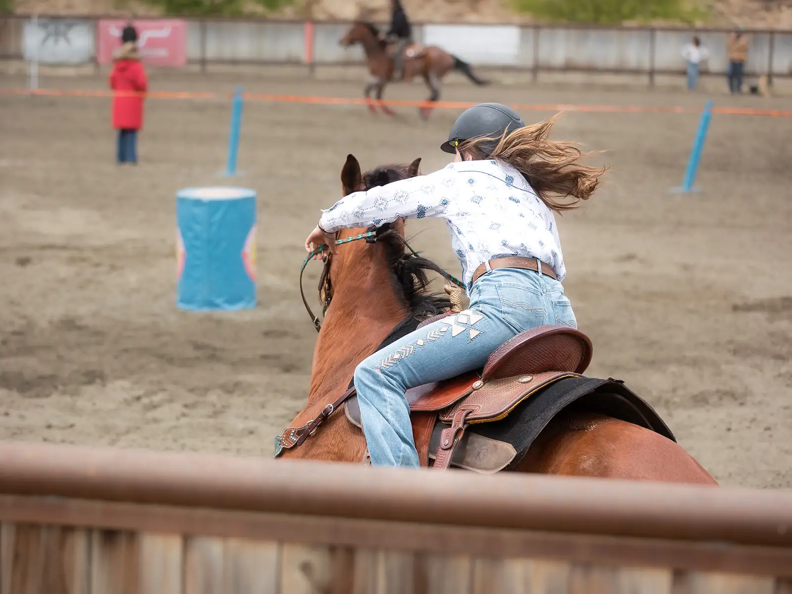Rider heading into a barrels pattern at a gymkhana